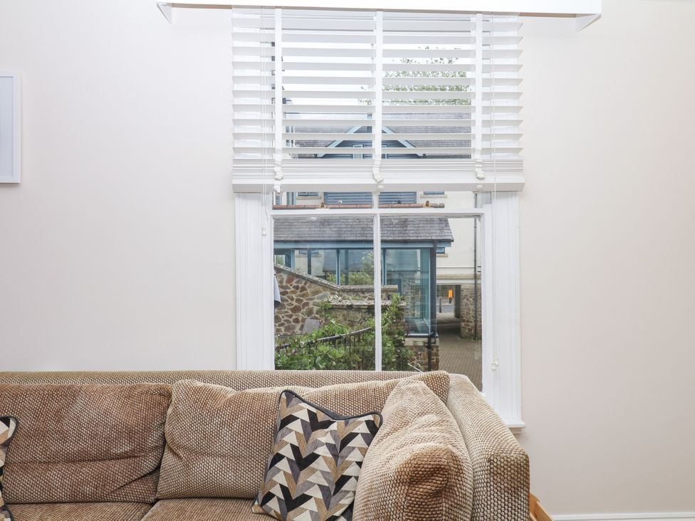 A living room with a window and sofa at Dennings House, Mayors Avenue in Dartmouth