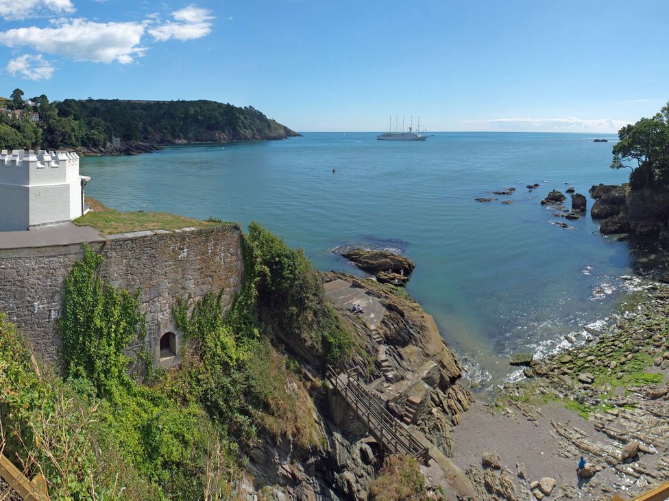 A view of the water and rocky shore at Dennings House, Mayors Avenue in Dartmouth