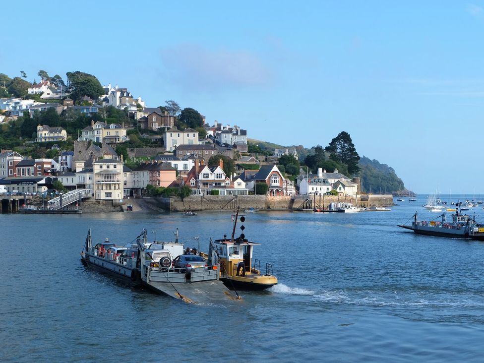 A scenic view of houses along a harbor with boats at Dennings House, Mayors Avenue, Dartmouth