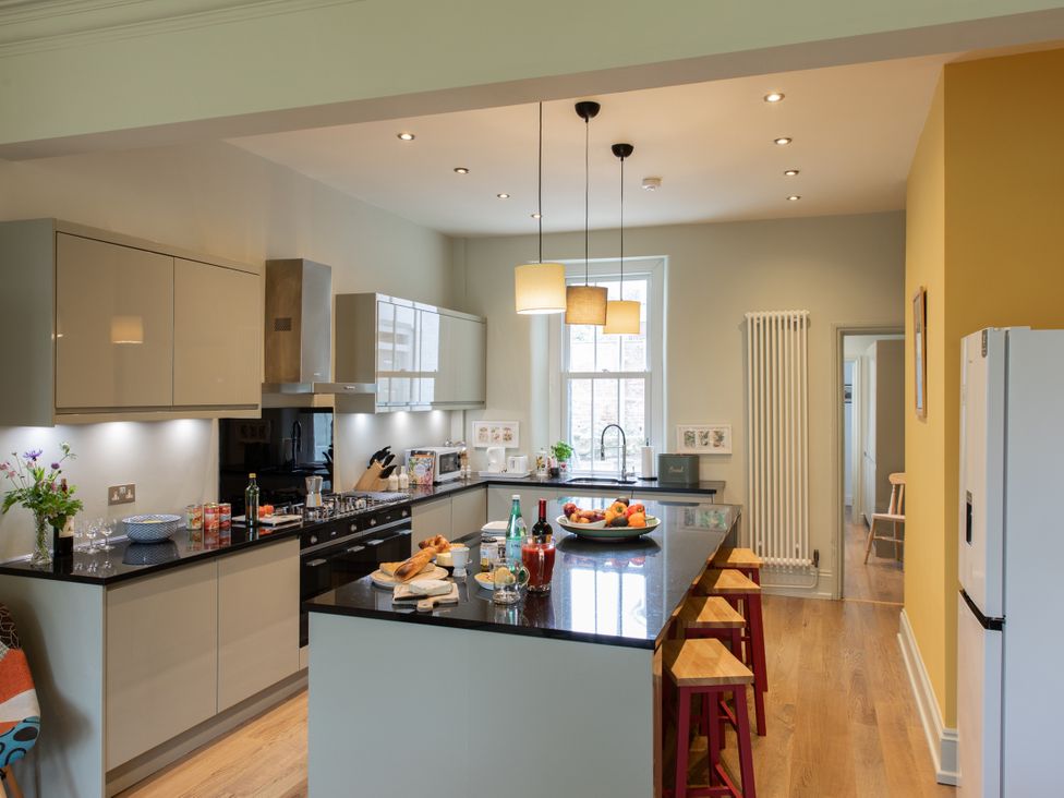 A kitchen with cabinets, countertops, and a fruit bowl at The Clarence in Bishop Auckland