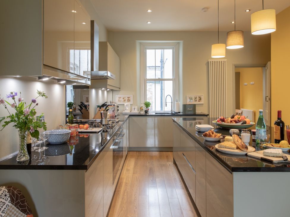 A kitchen with a countertop, sink, and stove at The Clarence in Bishop Auckland