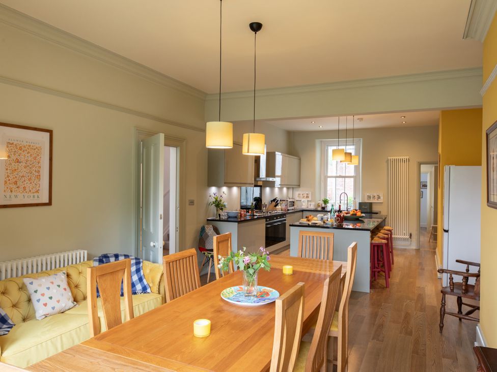 A kitchen with dining table and chairs at The Clarence in Bishop Auckland
