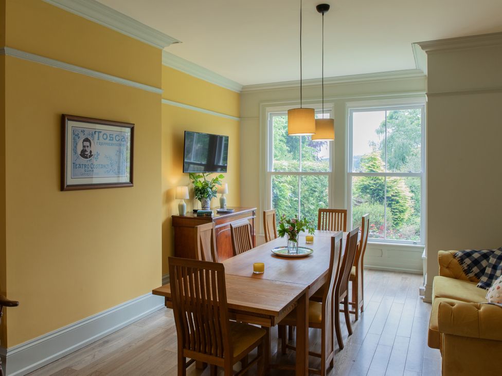A dining room with a table and chairs at The Clarence in Bishop Auckland