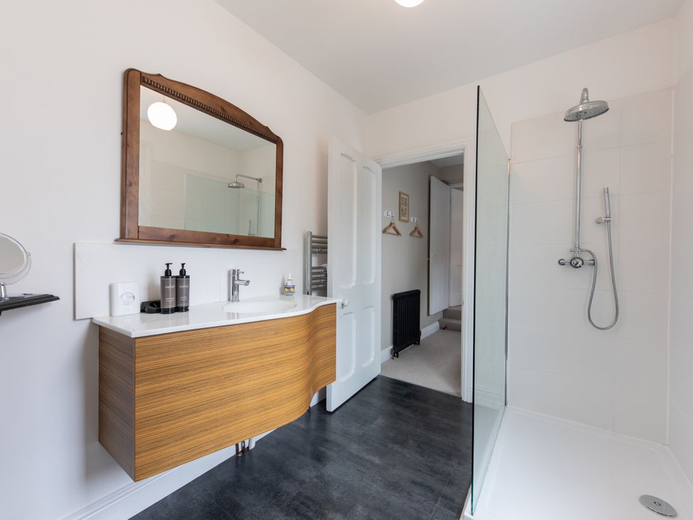 A bathroom with a shower and vanity at The Clarence Bishop Auckland