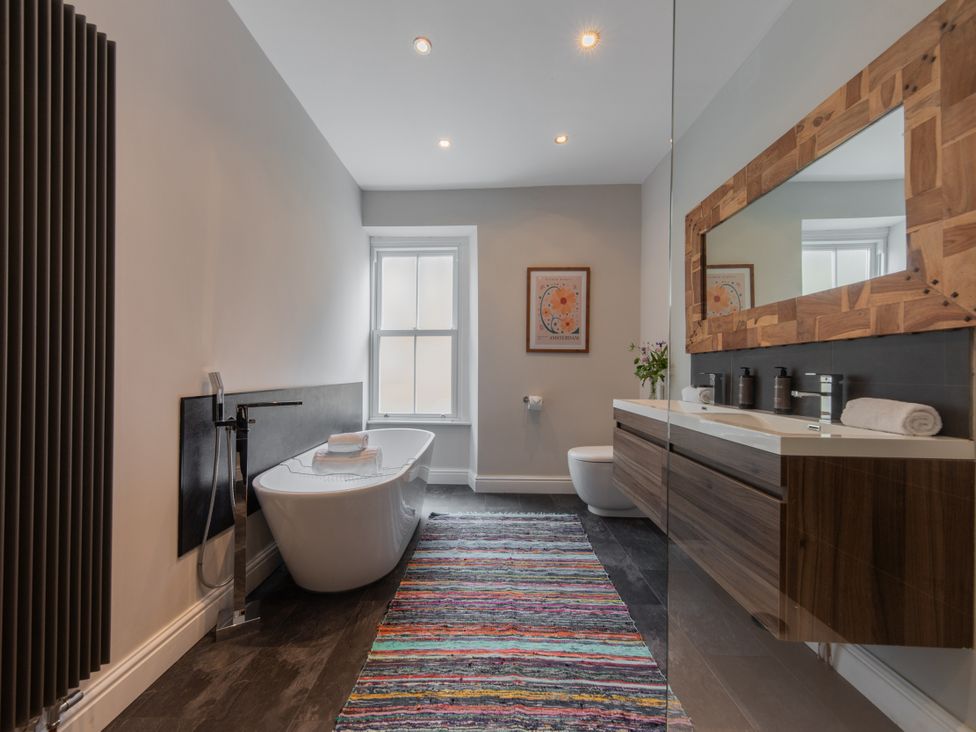 A bathroom with a bathtub and sink at The Clarence in Bishop Auckland