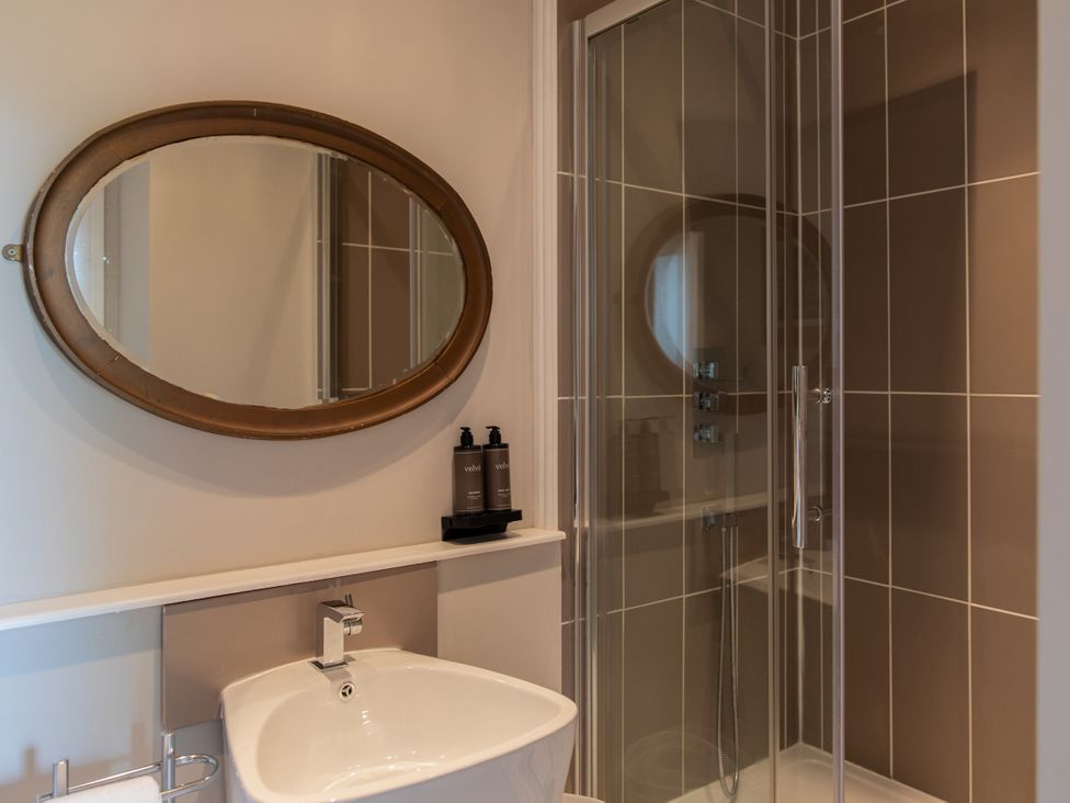 A bathroom with a sink and shower at The Clarence in Bishop Auckland