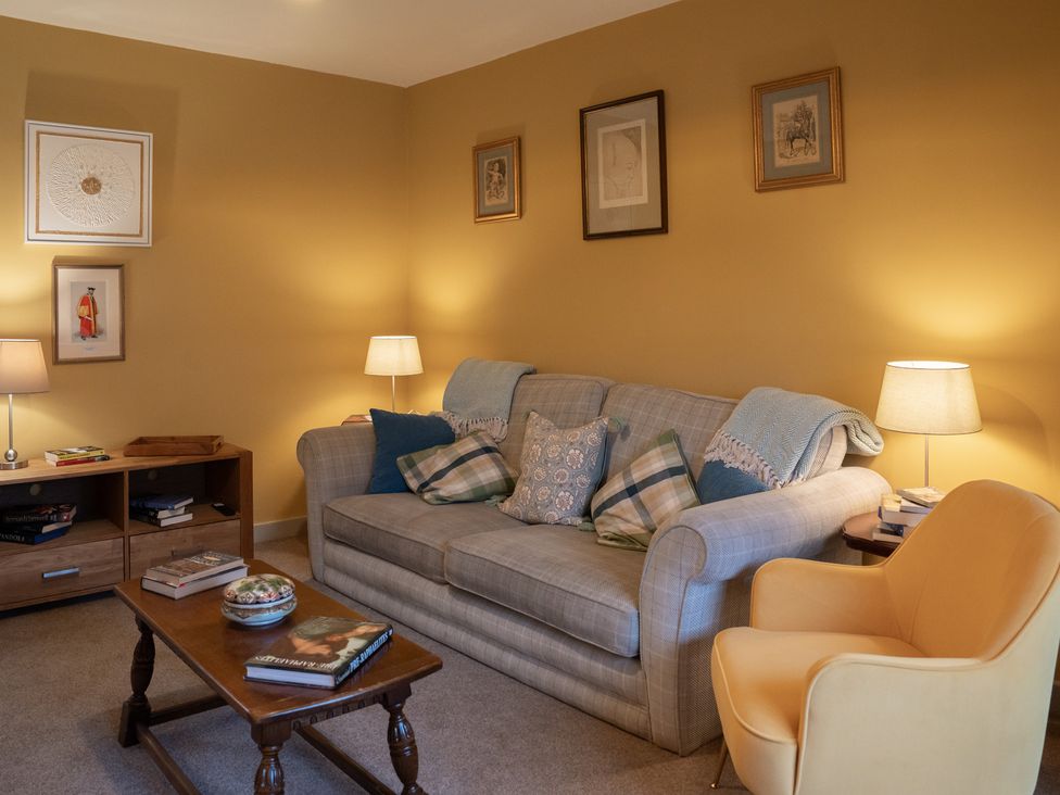 A living room with a sofa and coffee table at Churchill Cottage Bishop Auckland