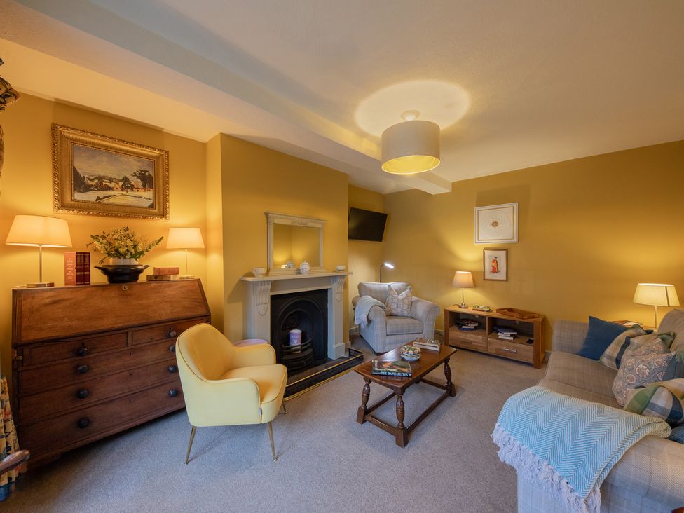 A living room with furniture and decor at Churchill Cottage in Bishop Auckland