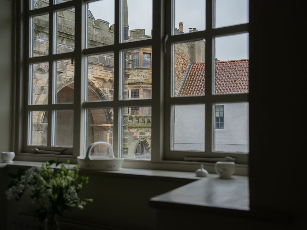 A view through a window of buildings outside at Churchill Cottage in Bishop Auckland