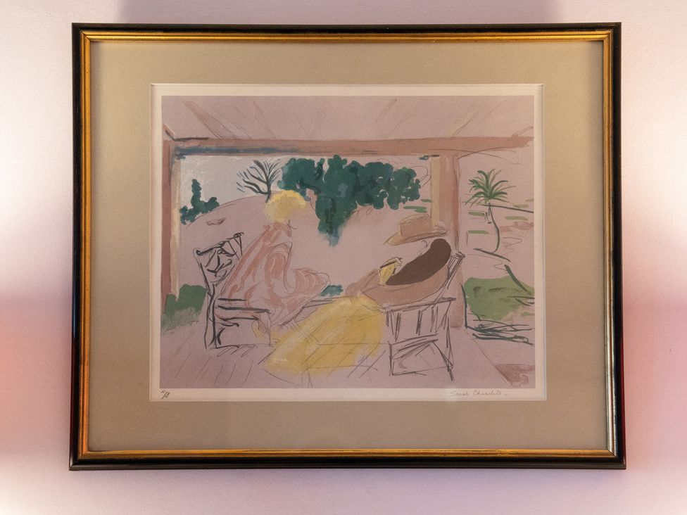 A painting displayed in a frame on a wall at Churchill Cottage in Bishop Auckland