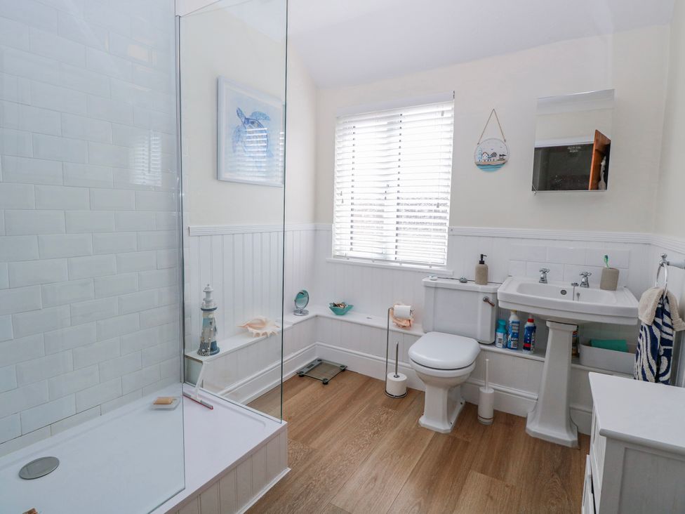 A bathroom with a shower and toilet at 17 Woodside Avenue in King's Lynn
