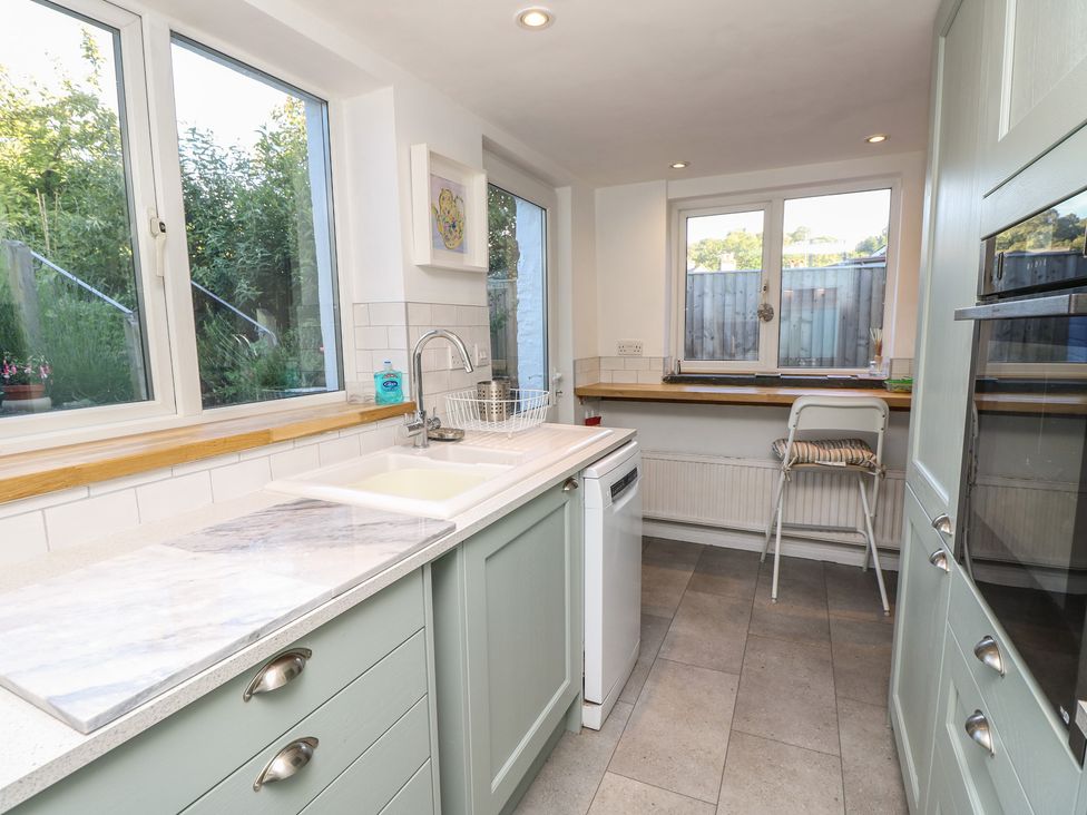 A kitchen with a sink and dishwasher at 5 Castle Street in Newport, Isle Of Wight
