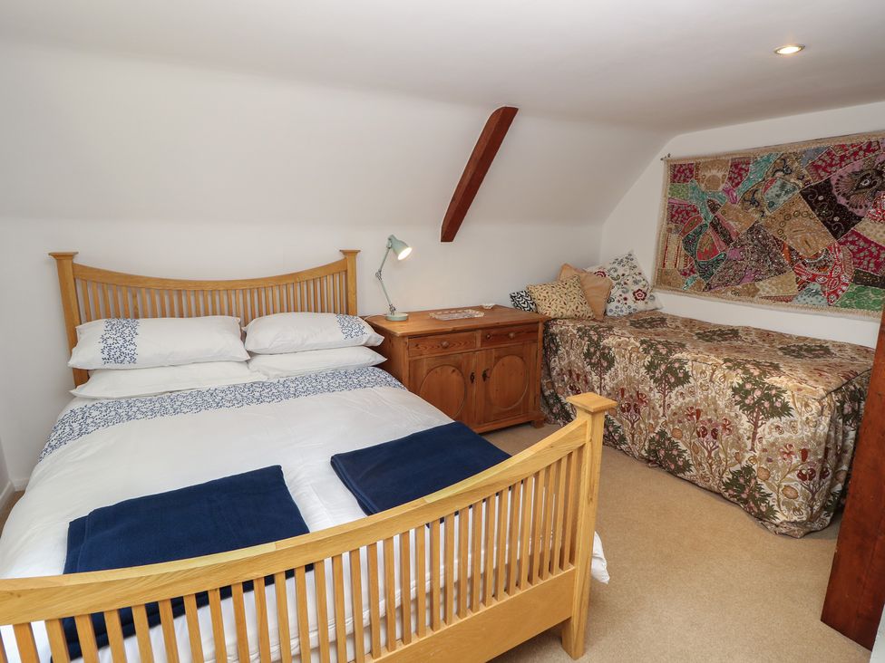 A bedroom with a bed and couch at 5 Castle Street Newport, Isle Of Wight
