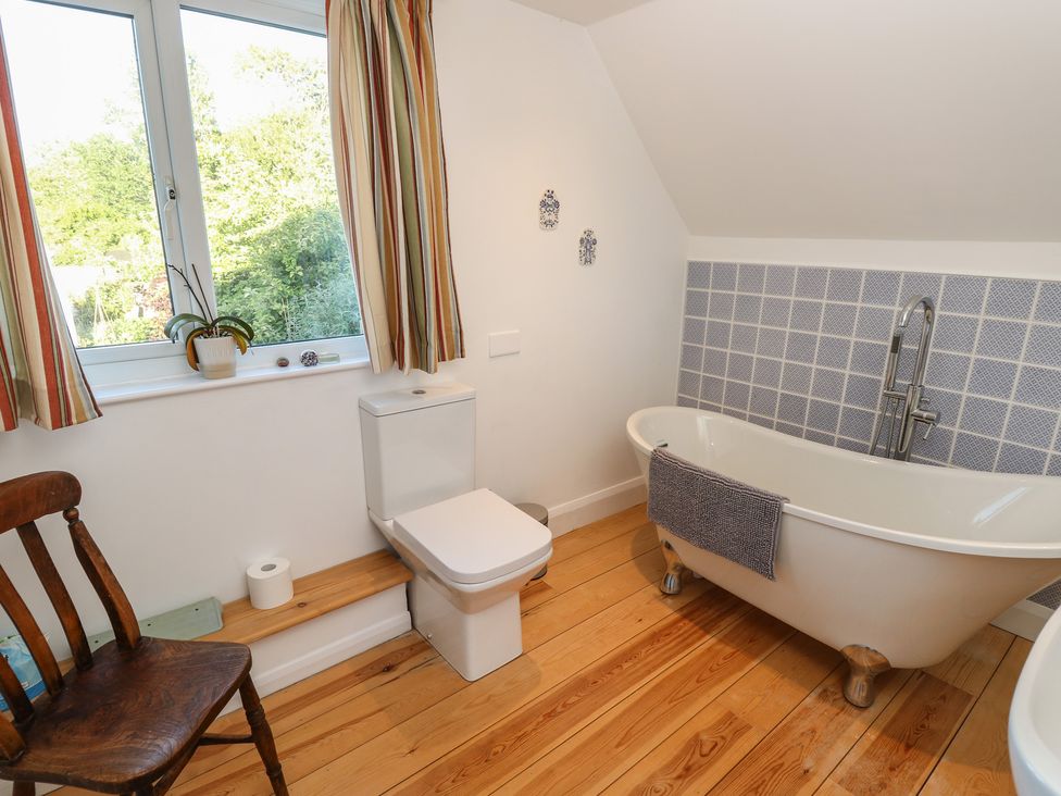 A bathroom with a bathtub and toilet at 5 Castle Street, Newport, Isle Of Wight
