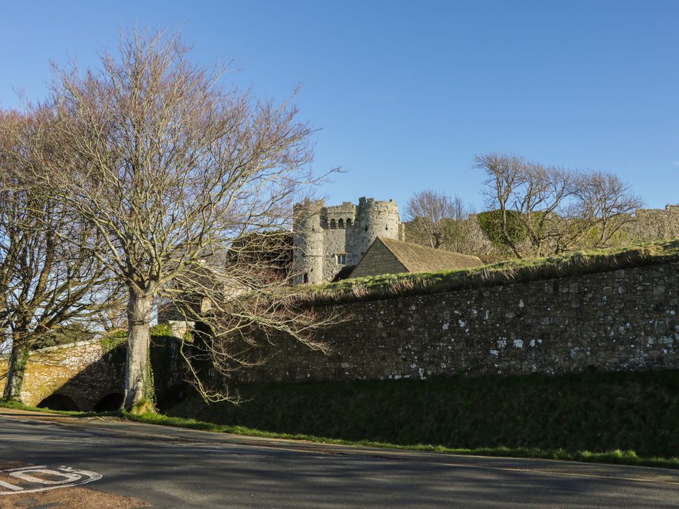A castle and trees beside a road at 5 Castle Street in Newport, Isle Of Wight