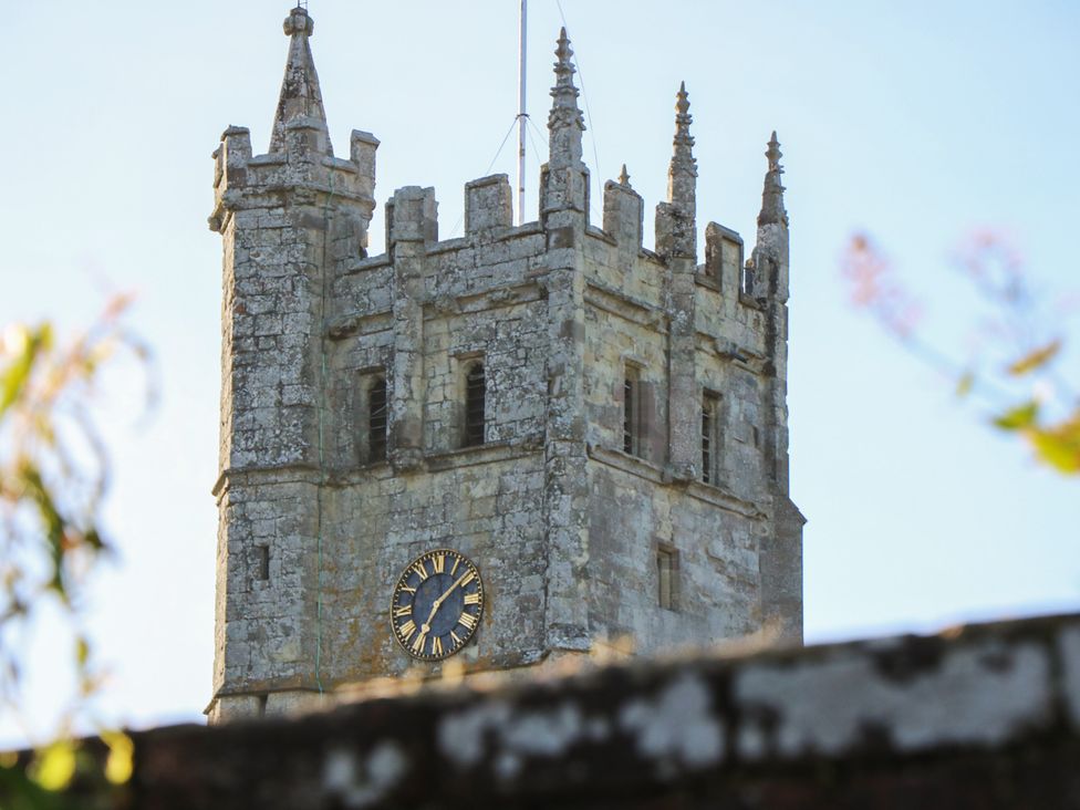 A stone clock tower with spires at 5 Castle Street, Newport, Isle Of Wight