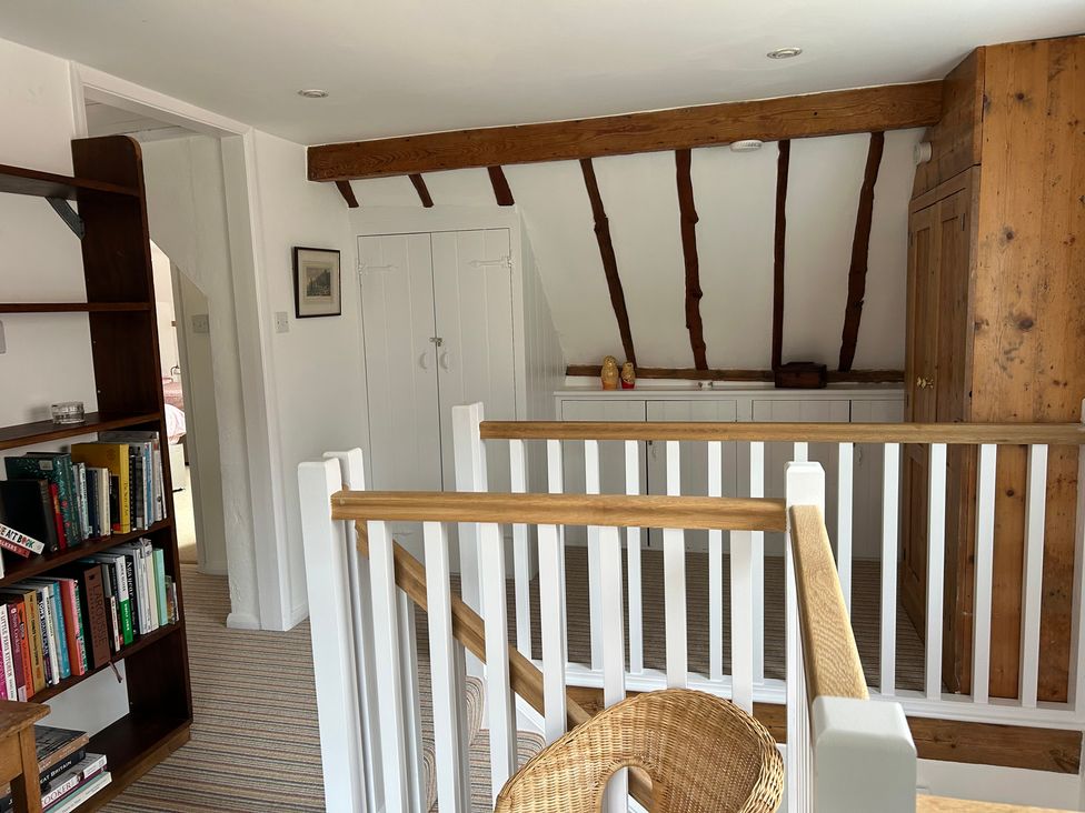 A landing area with a bookshelf and cabinets at 5 Castle Street, Newport, Isle Of Wight