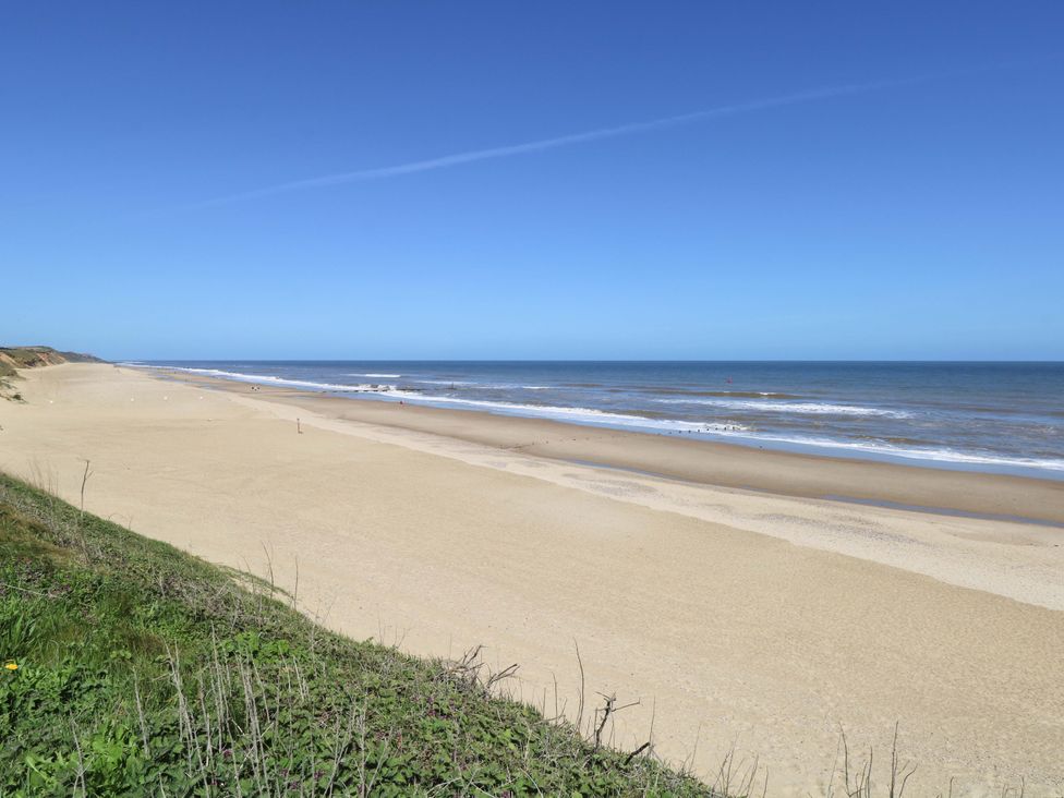 A beach with sand and ocean view at The Bungalow in 