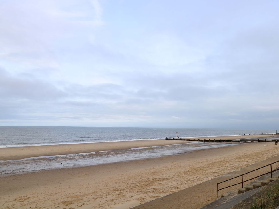 A beach view with sand and ocean at The Bungalow in 
