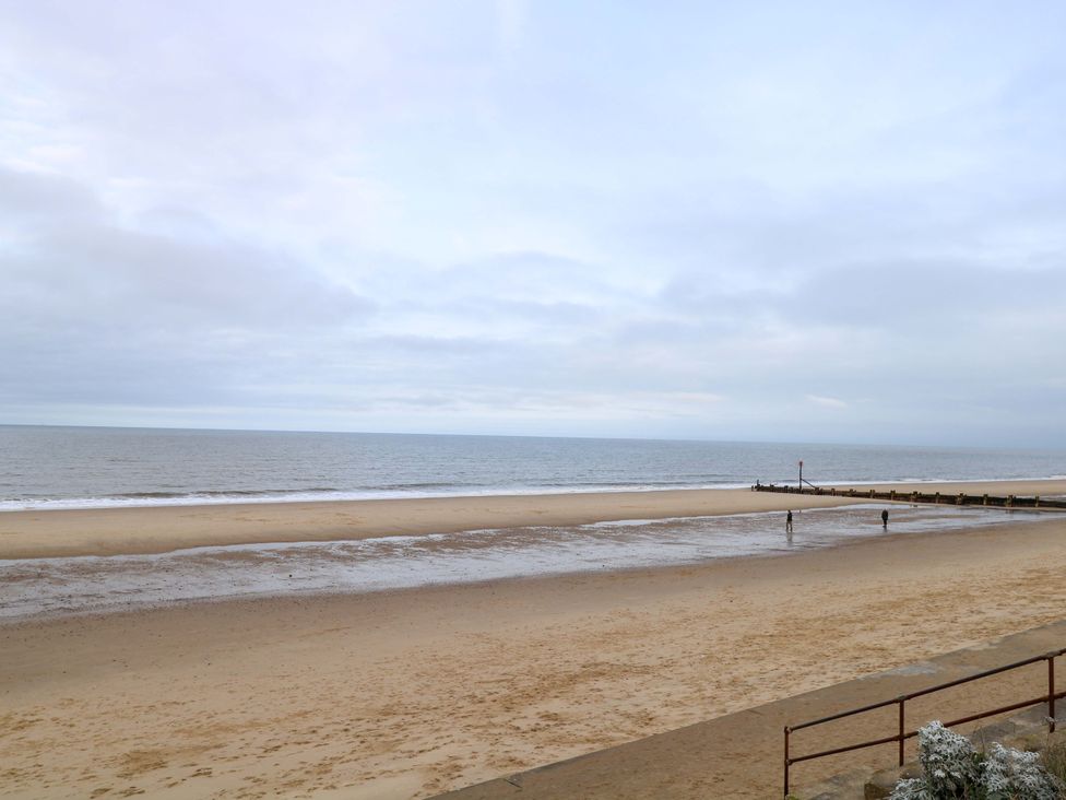 A beach with sand and water at The Bungalow in 