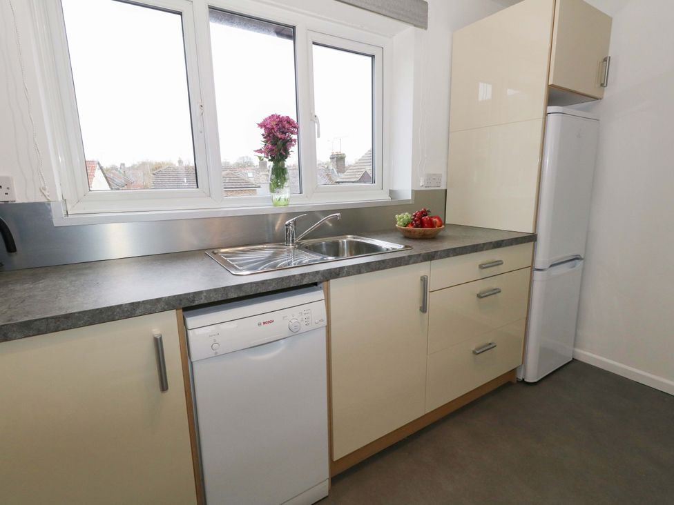 A kitchen with sink and appliances at Amber House Dorchester