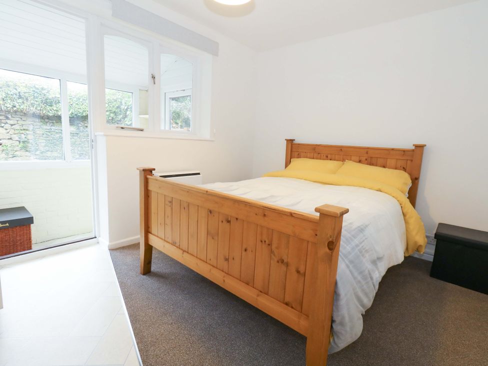 A bedroom with a bed and a window at Amber House in Dorchester