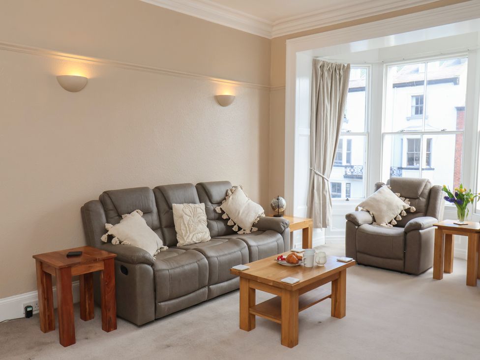 A living room with a sofa and armchairs at Time Out in Whitby
