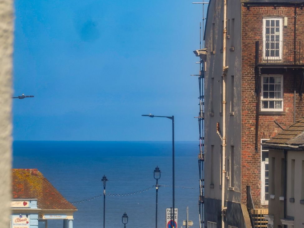 A view of buildings and the sea at Time Out in Whitby