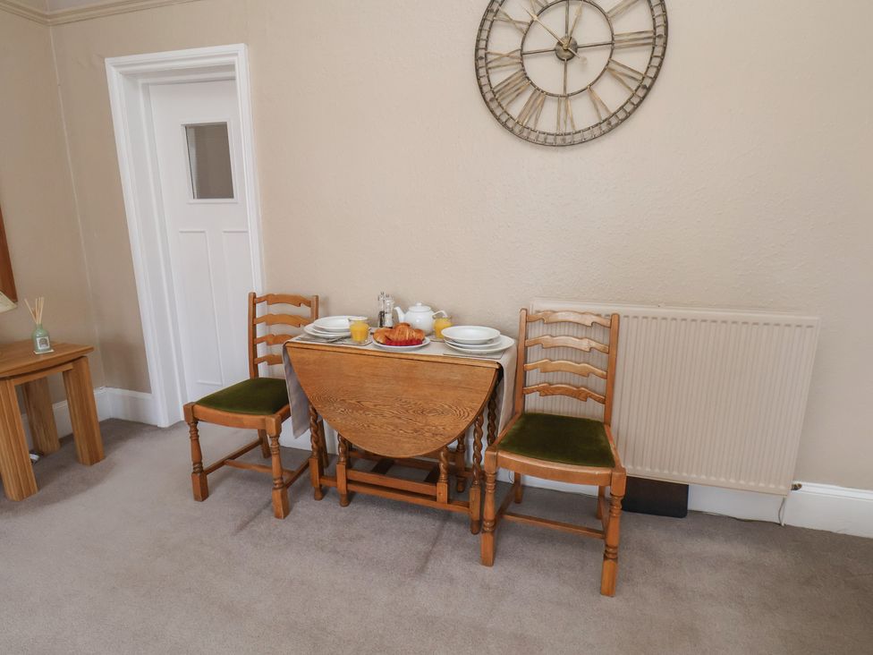 A dining room with a table set for breakfast at Time Out in Whitby