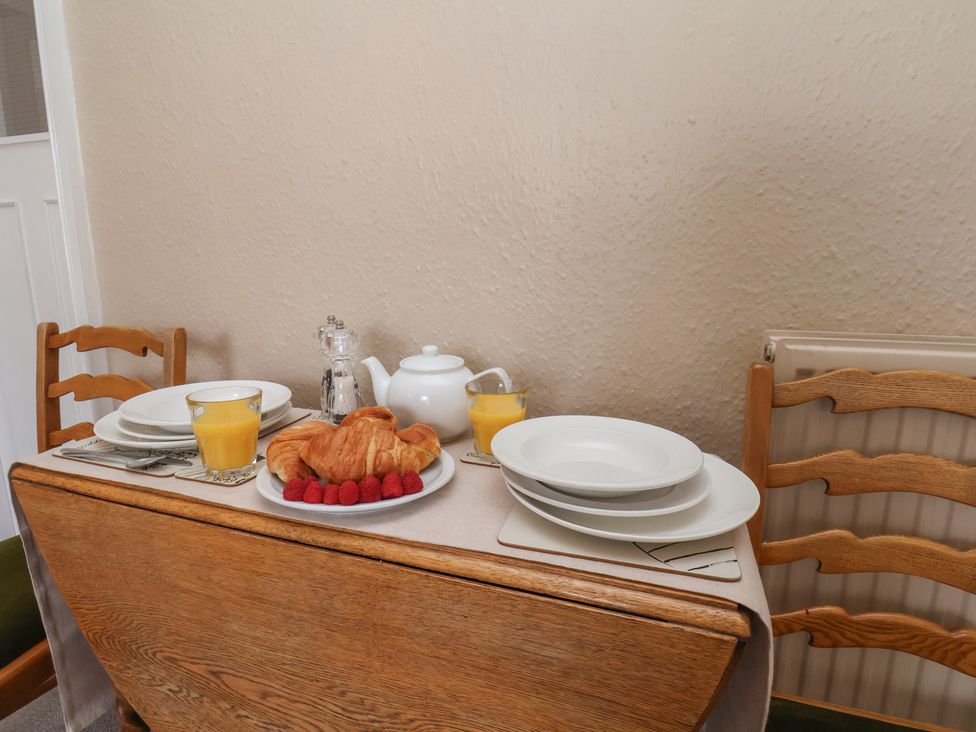 A dining table set with plates and food at Time Out in Whitby