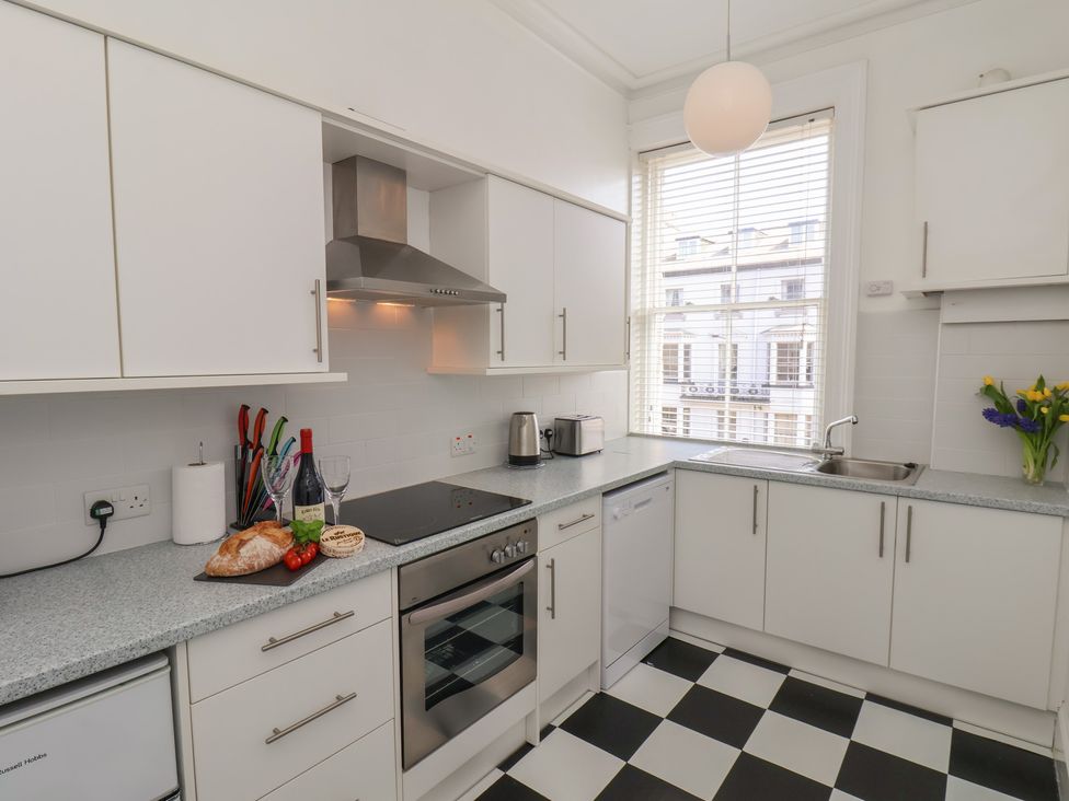 A kitchen with appliances and food items at Time Out in Whitby