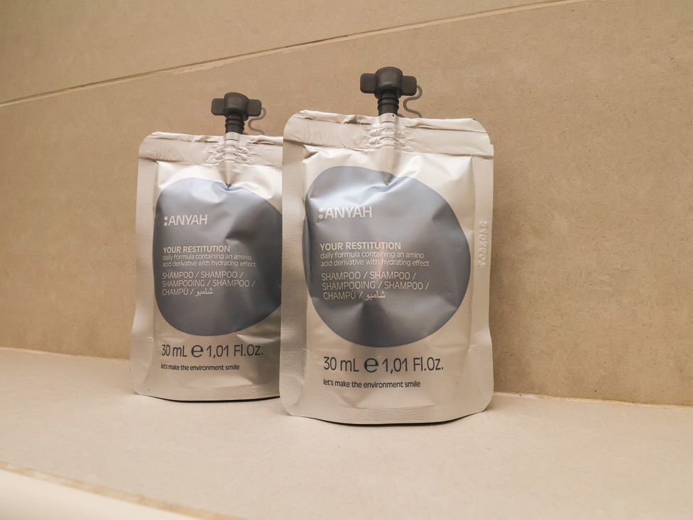 Two shampoo packets on a counter at Time Out in Whitby