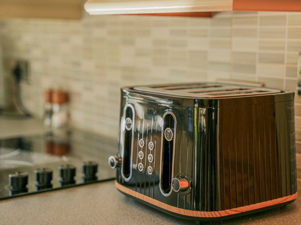 A toaster on a kitchen countertop at Maple Lodge Llangunllo