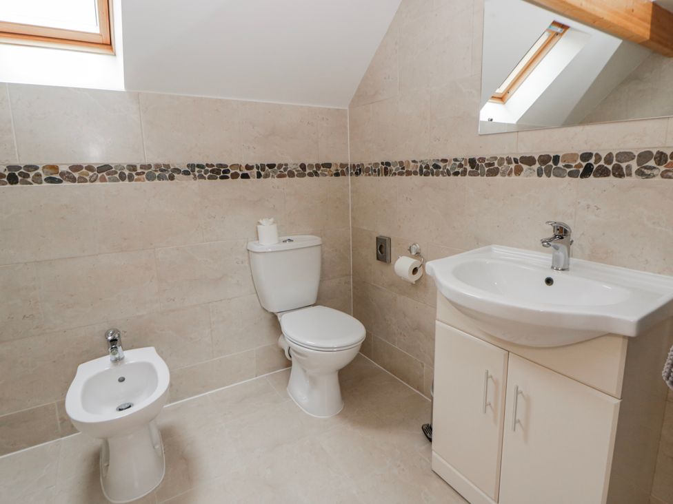 A bathroom with a sink, toilet, and bidet at Willow Lodge in Knighton