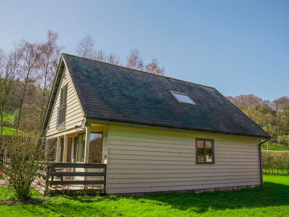 A house with a balcony and windows at Willow Lodge in Laceby