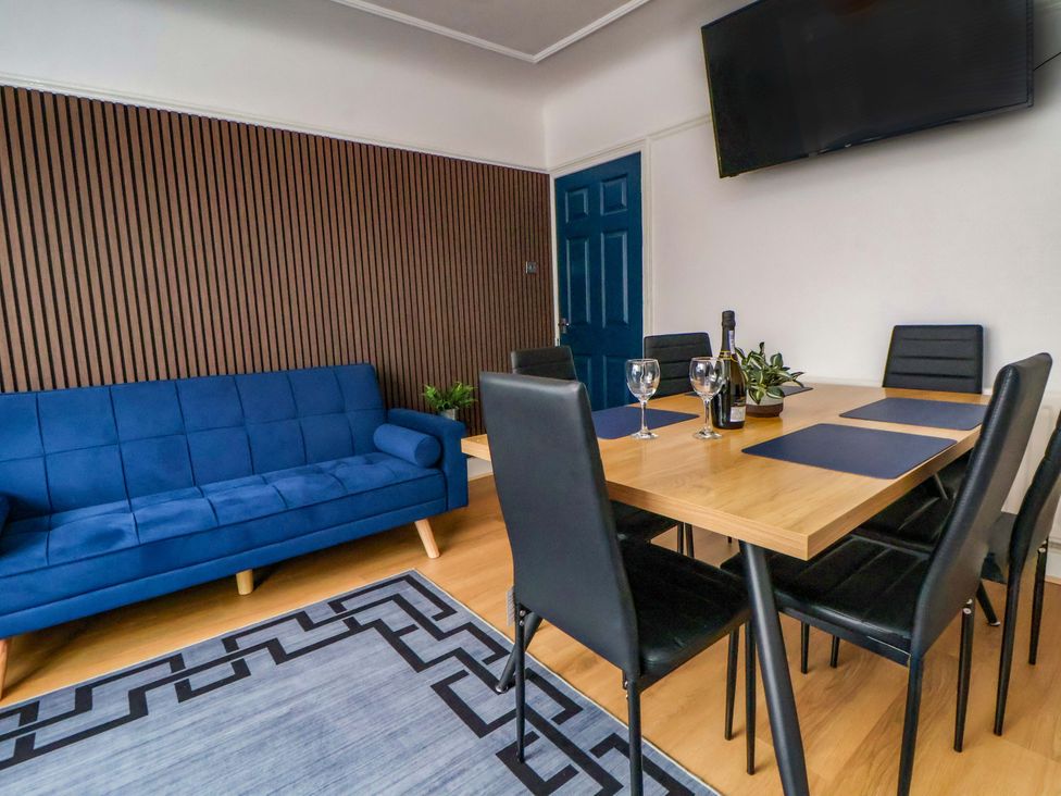 A dining room with a table and chairs at Wallasey Village Escape by the Sea in Wallasey