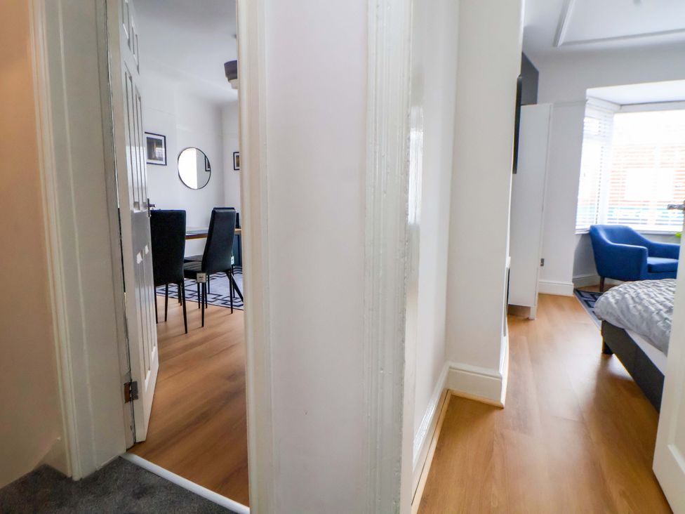 A hallway leading to a dining area and living space at Wallasey Village Escape by the Sea Wallasey