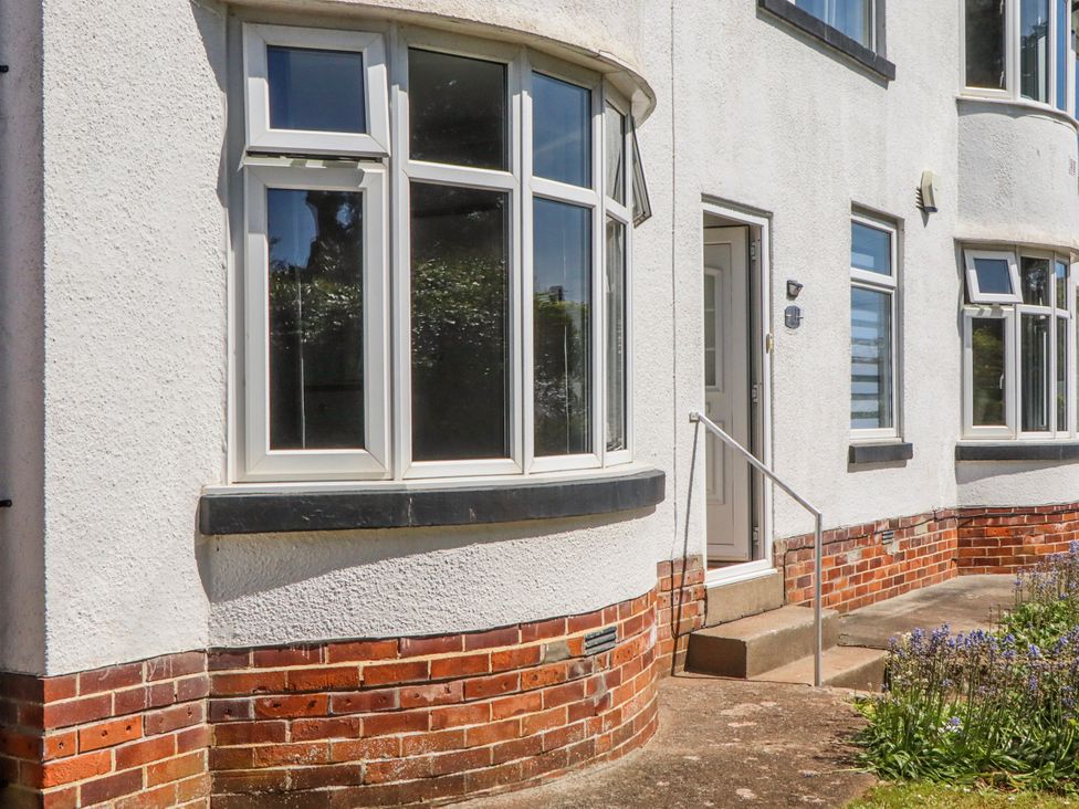 An outdoor area with windows and a front door at The Arches in Torquay