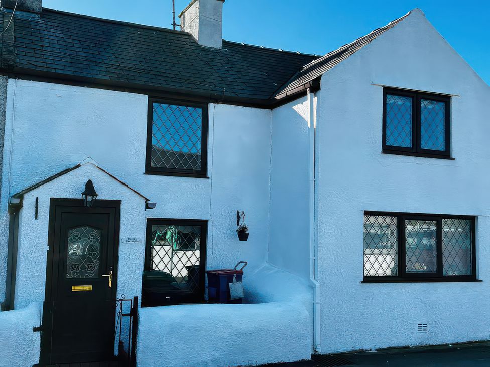 A house exterior with windows and a door at Preswylfa, Tregele near Cemaes Bay