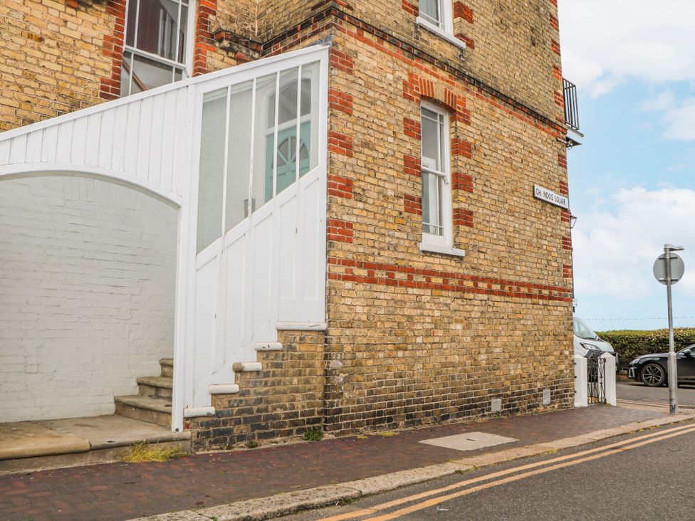An outdoor area with a brick building and stairs at Broadstairs Beach in Broadstairs