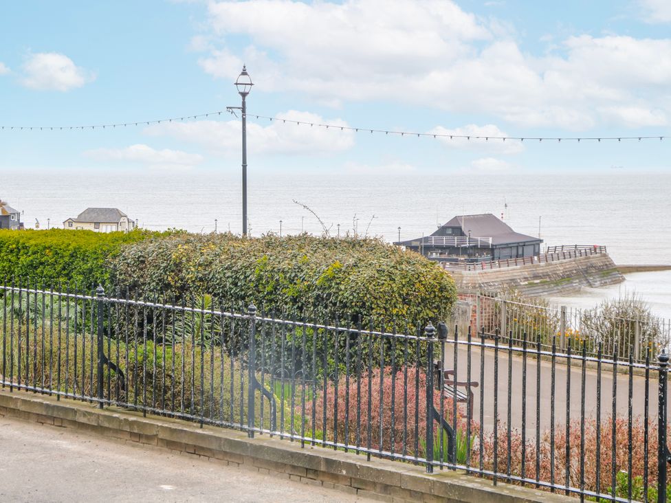 An outdoor view of the ocean and pier at Broadstairs Beach in Broadstairs