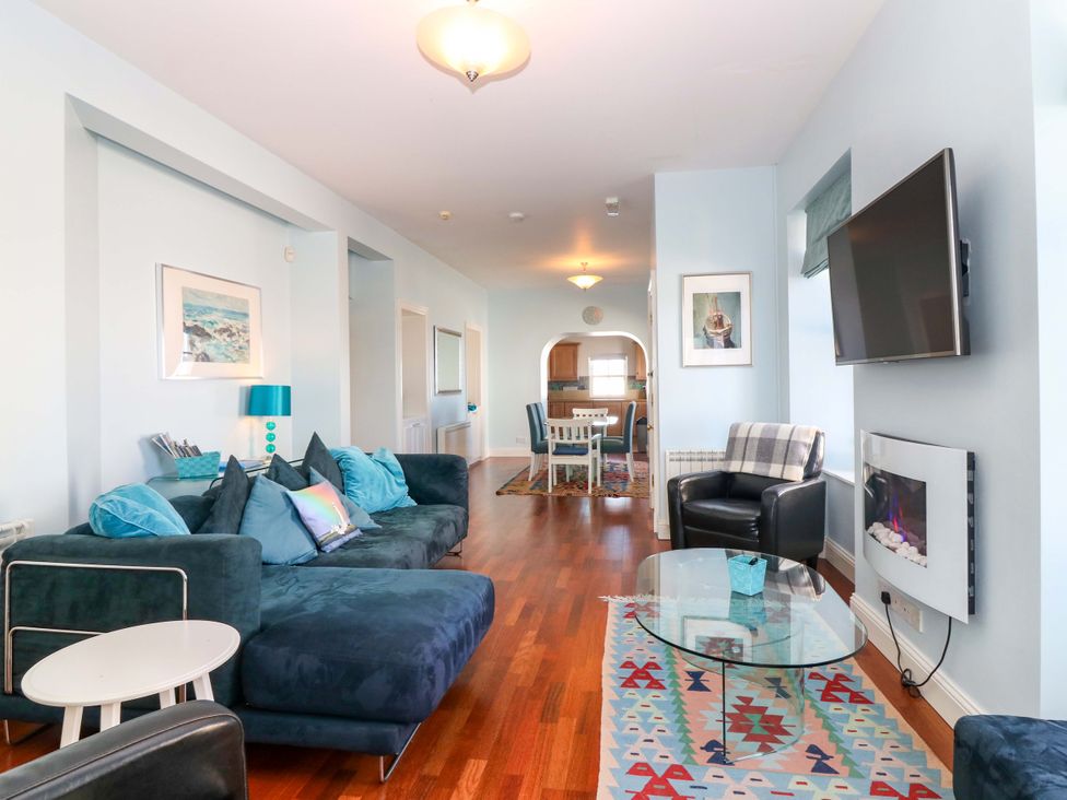 A living room with a sofa and coffee table at The Lighthouse Keepers Cottage St Abbs
