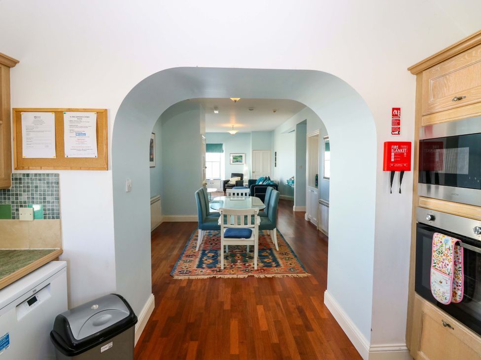 A kitchen with an archway leading to a dining area at The Lighthouse Keepers Cottage St Abbs