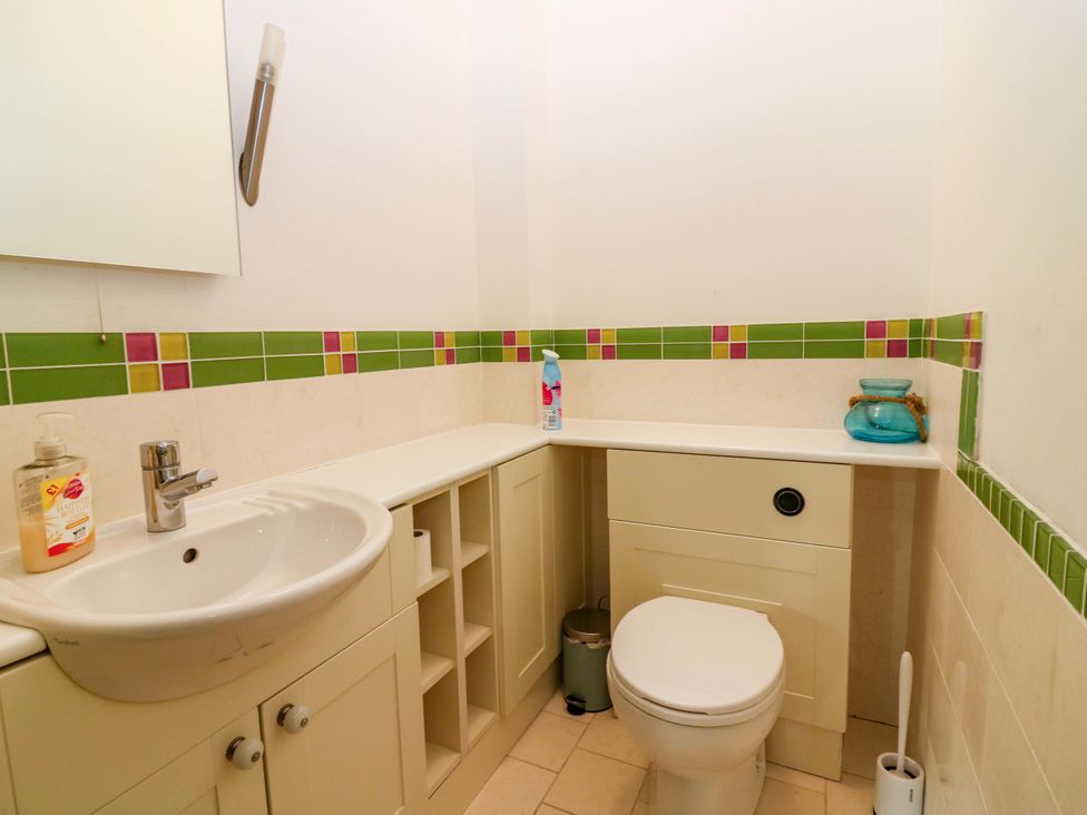A bathroom with a sink and toilet at The Lighthouse Keepers Cottage St Abbs