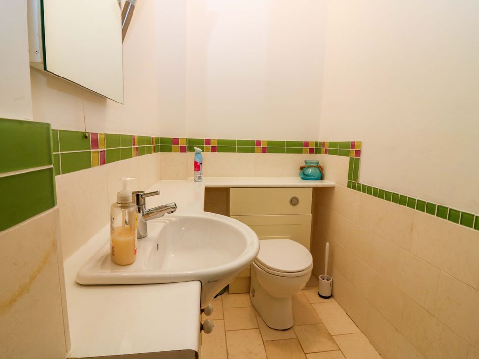 A bathroom with a sink and toilet at The Lighthouse Keepers Cottage St Abbs