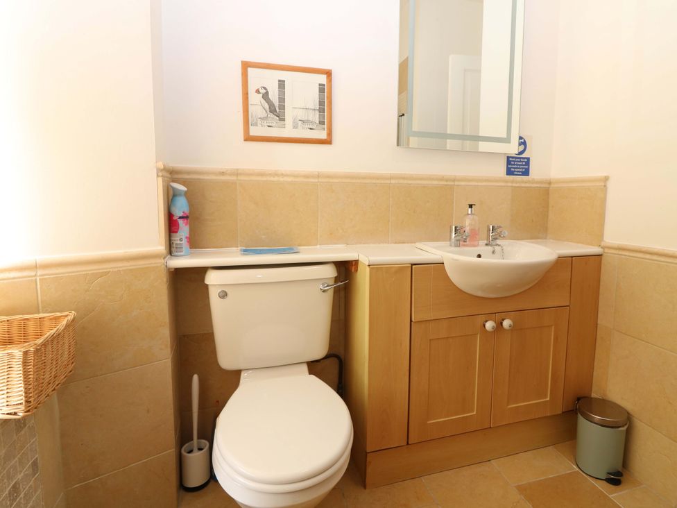 A bathroom with a toilet and sink at The Lighthouse Keepers Cottage St Abbs