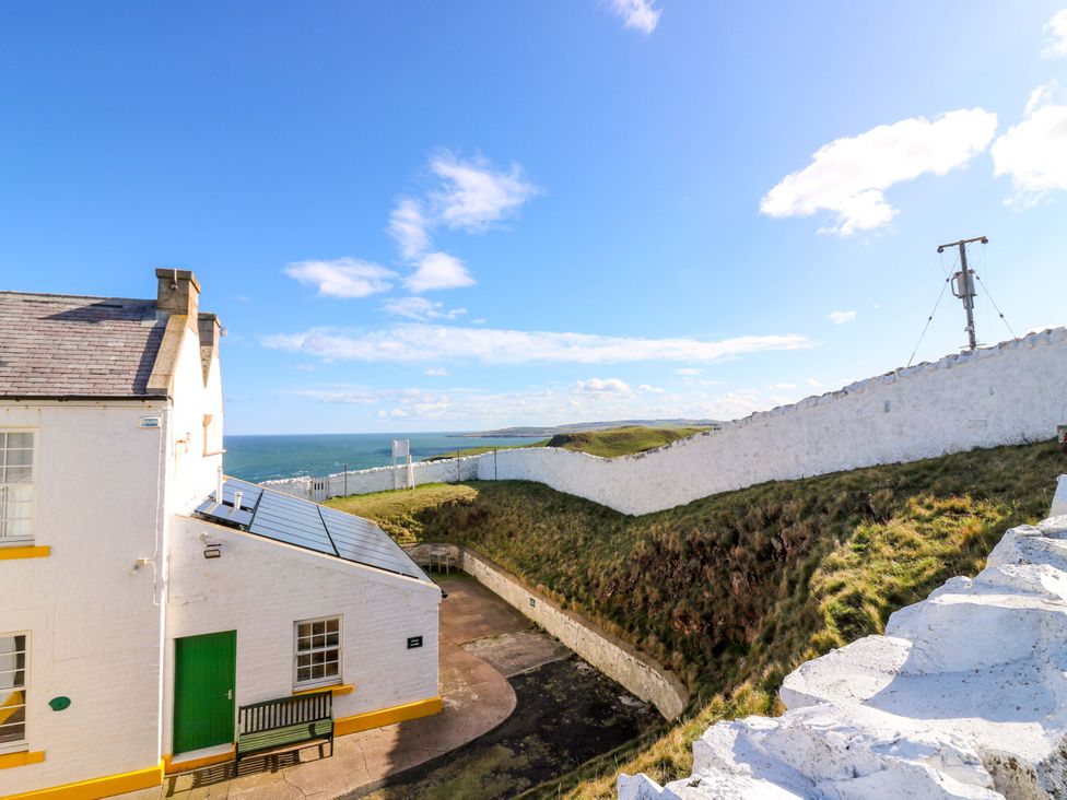 An outdoor view of a building near the sea at The Lighthouse Keepers Cottage St Abbs