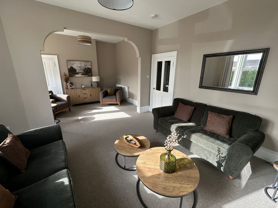 A living room with sofas and a coffee table at Abbotsford, Kelso