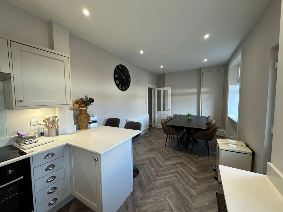 A kitchen with a dining table and chairs at Abbotsford in Kelso