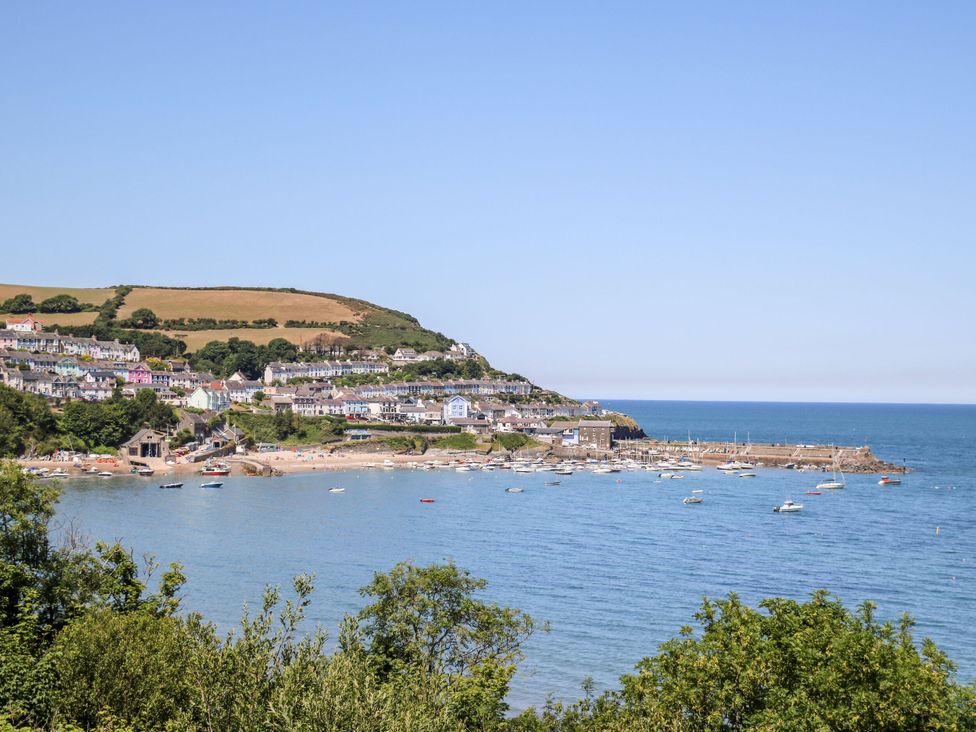 A coastal view with boats in the water at Ger Y Mor, New Quay